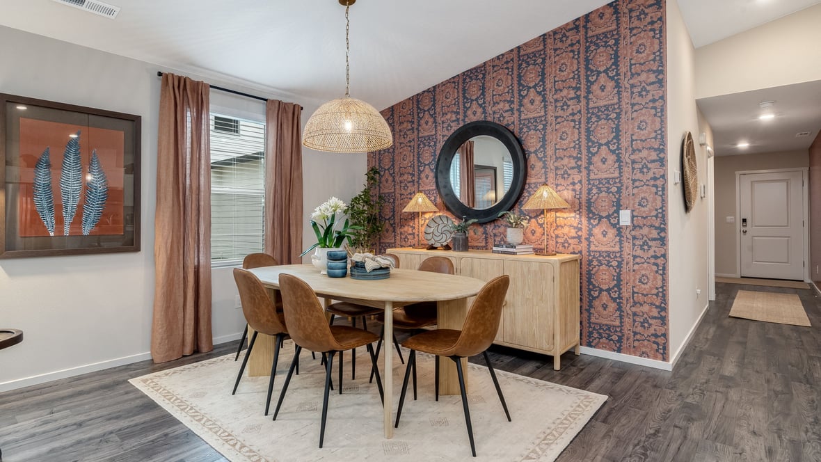 Great room with laminate flooring and an electric fireplace and vaulted ceilings