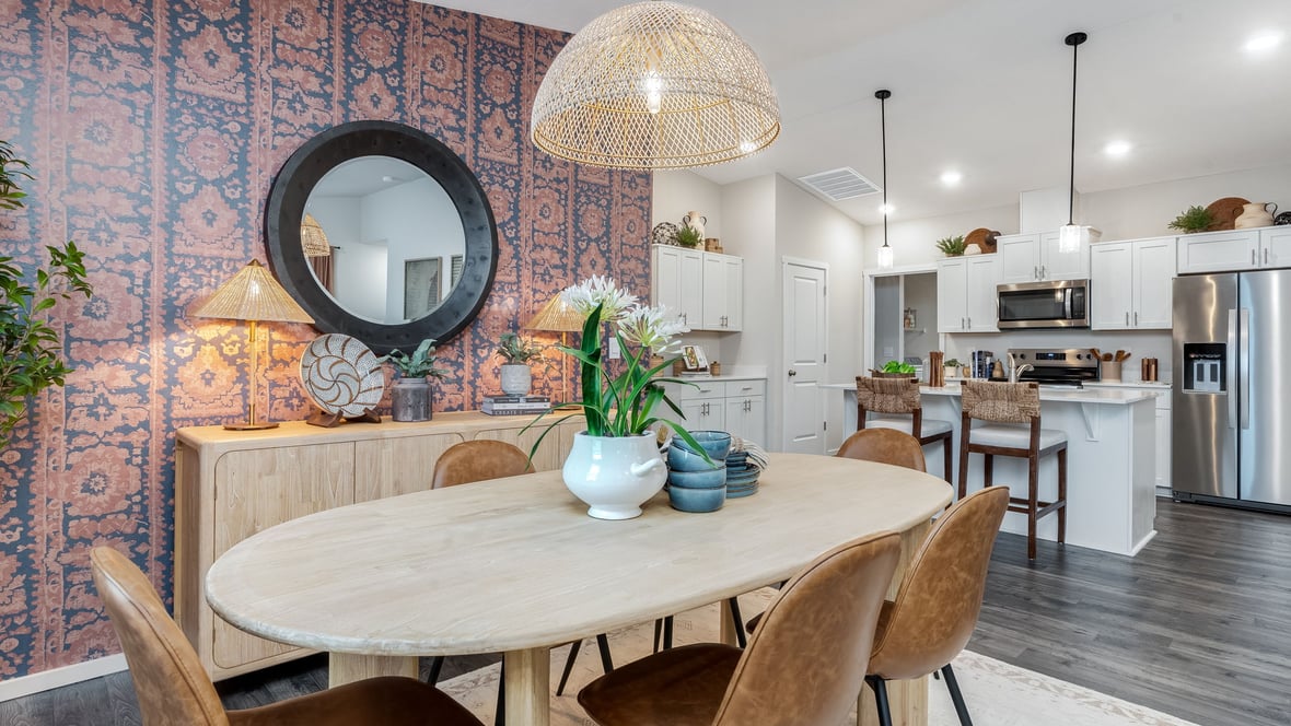 Great room with laminate flooring and an electric fireplace and vaulted ceilings