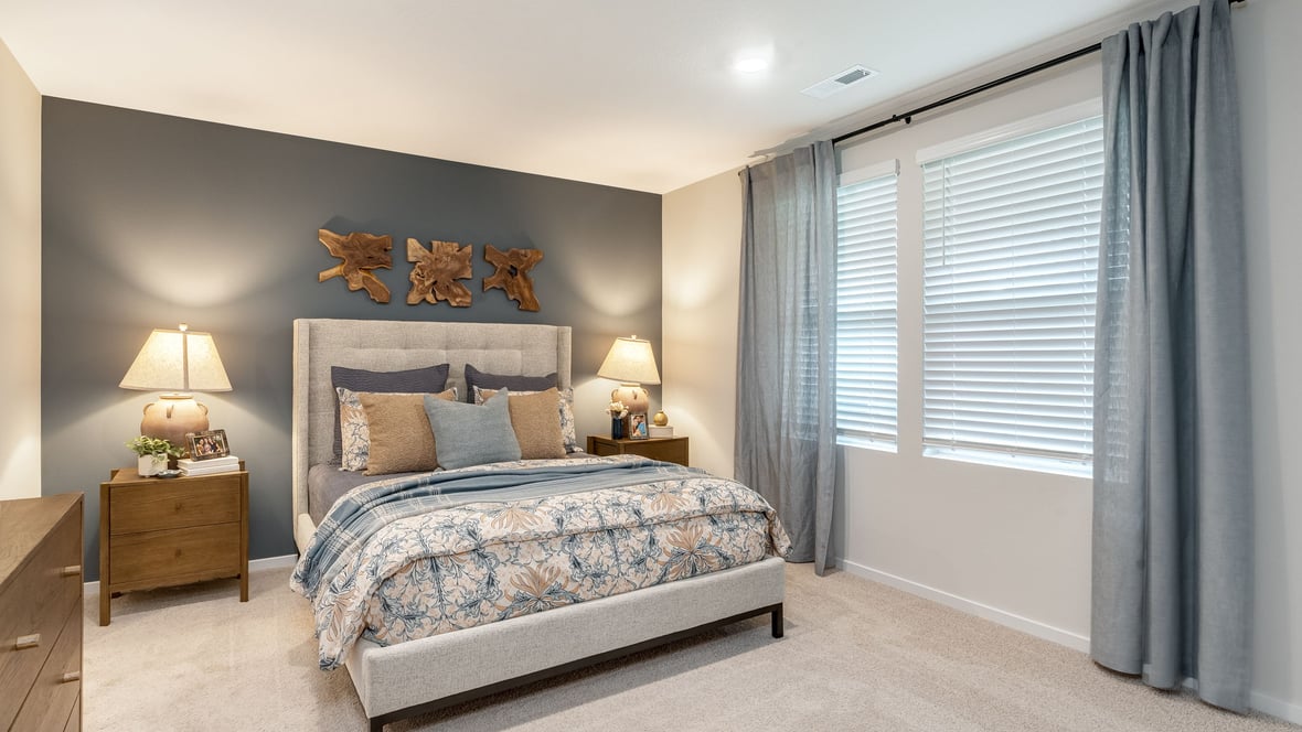 Primary bedroom with wall-to-wall carpet, a walk-in closet and an attached bathroom