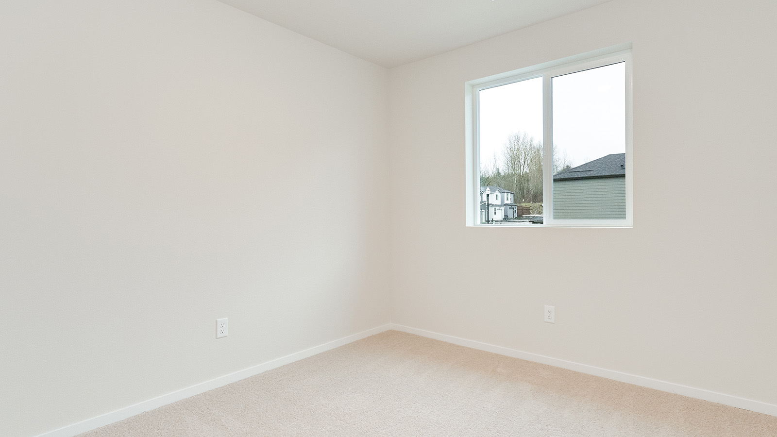 Bedroom with wall-to-wall carpet and a closet