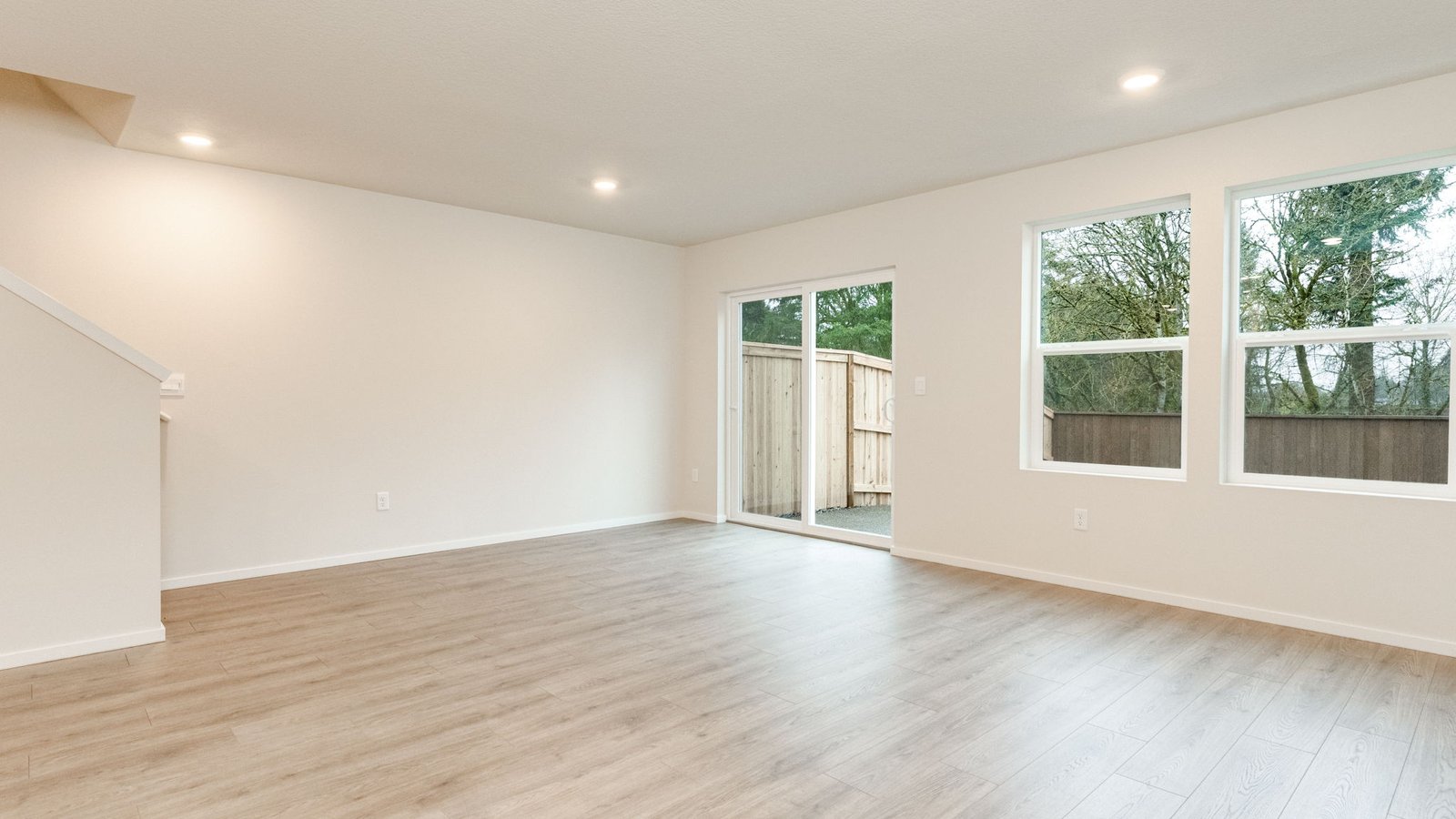 Great room with laminate flooring and an electric fireplace
