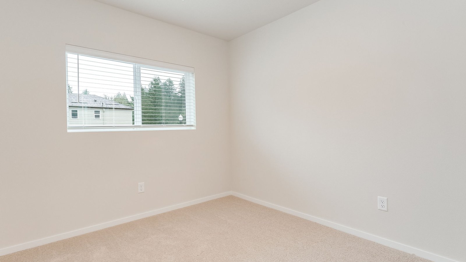 Bedroom with wall-to-wall carpet and a closet