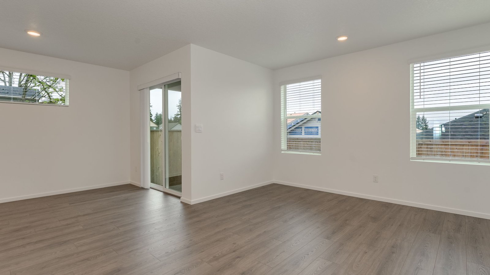 Great room with laminate flooring and an electric fireplace