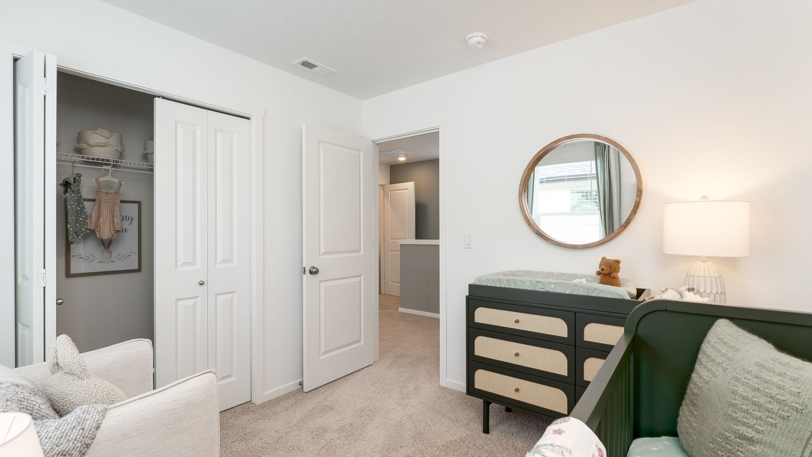 Bedroom with wall-to-wall carpet and a closet