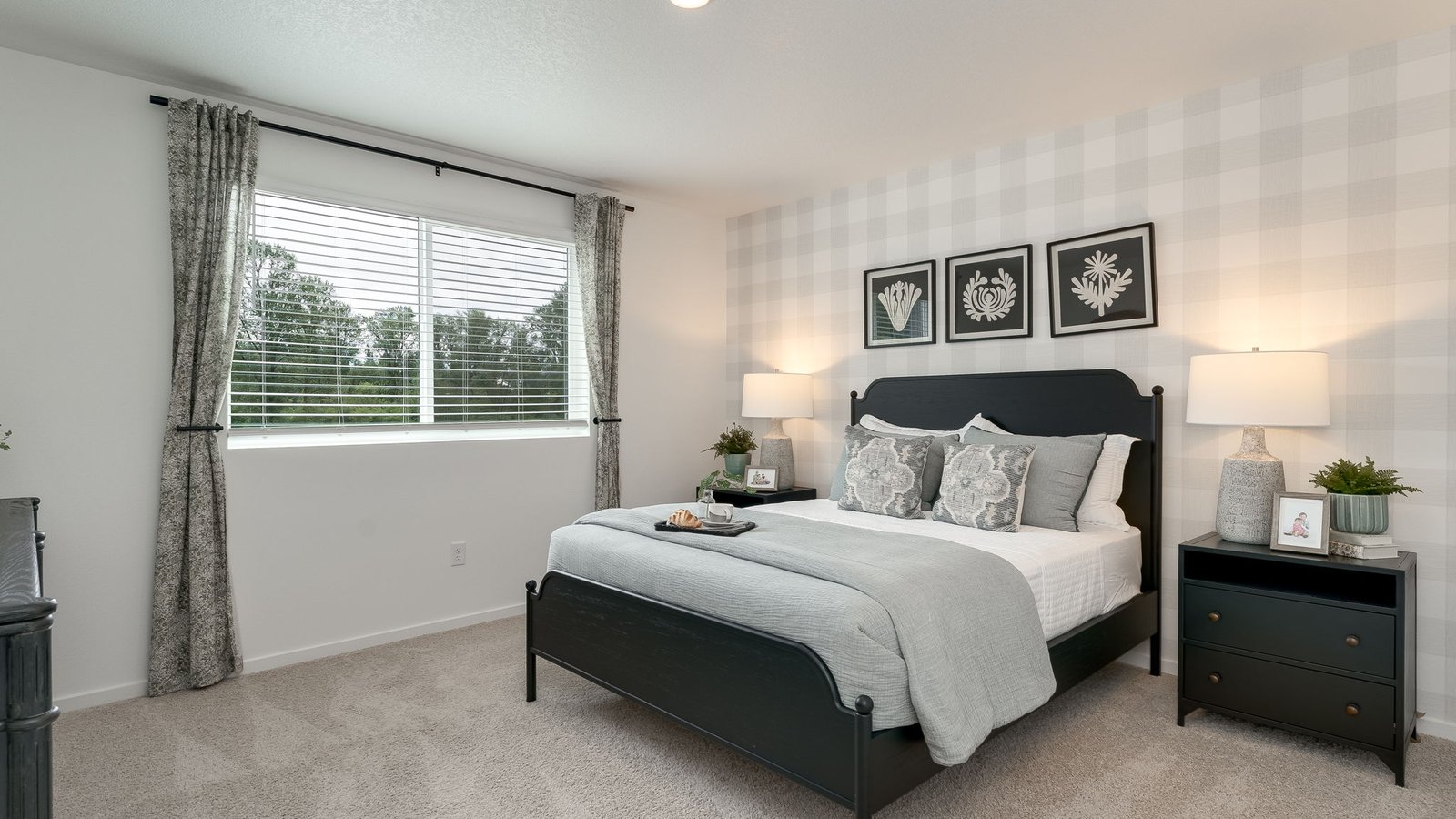 Primary bedroom with wall-to-wall carpet, a walk-in closet and an attached bathroom