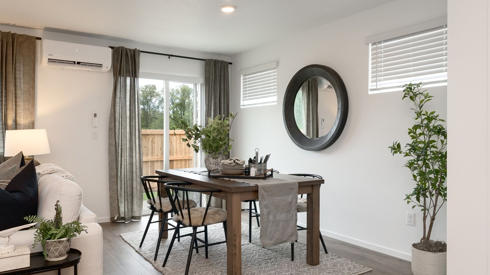 Dining area with a sliding glass door to a fenced backyard