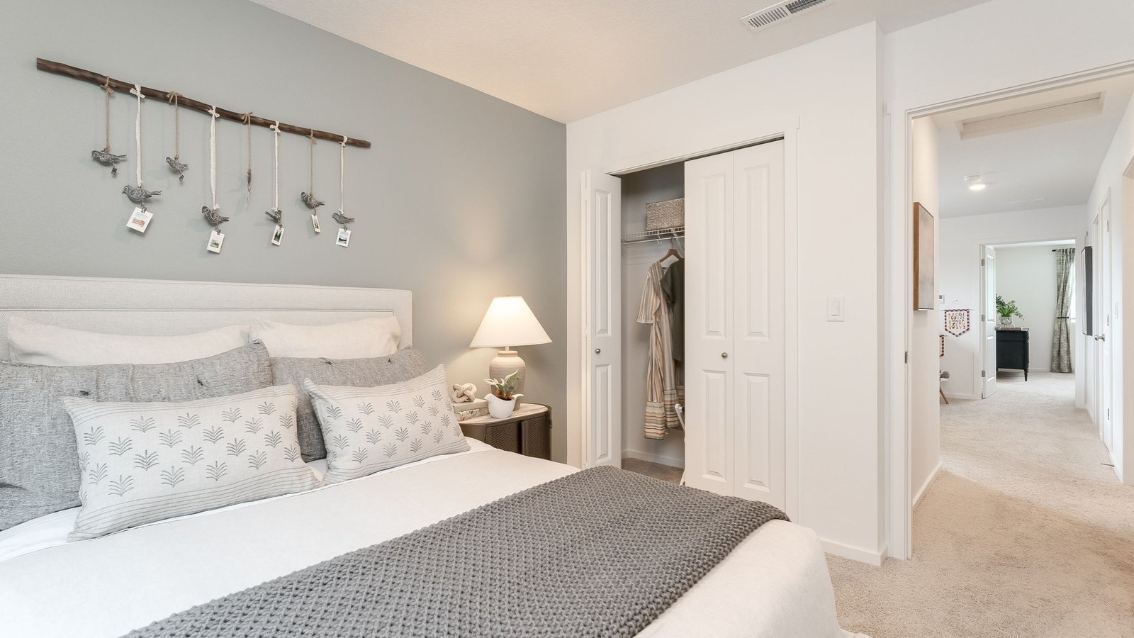 Bedroom with wall-to-wall carpet and a closet