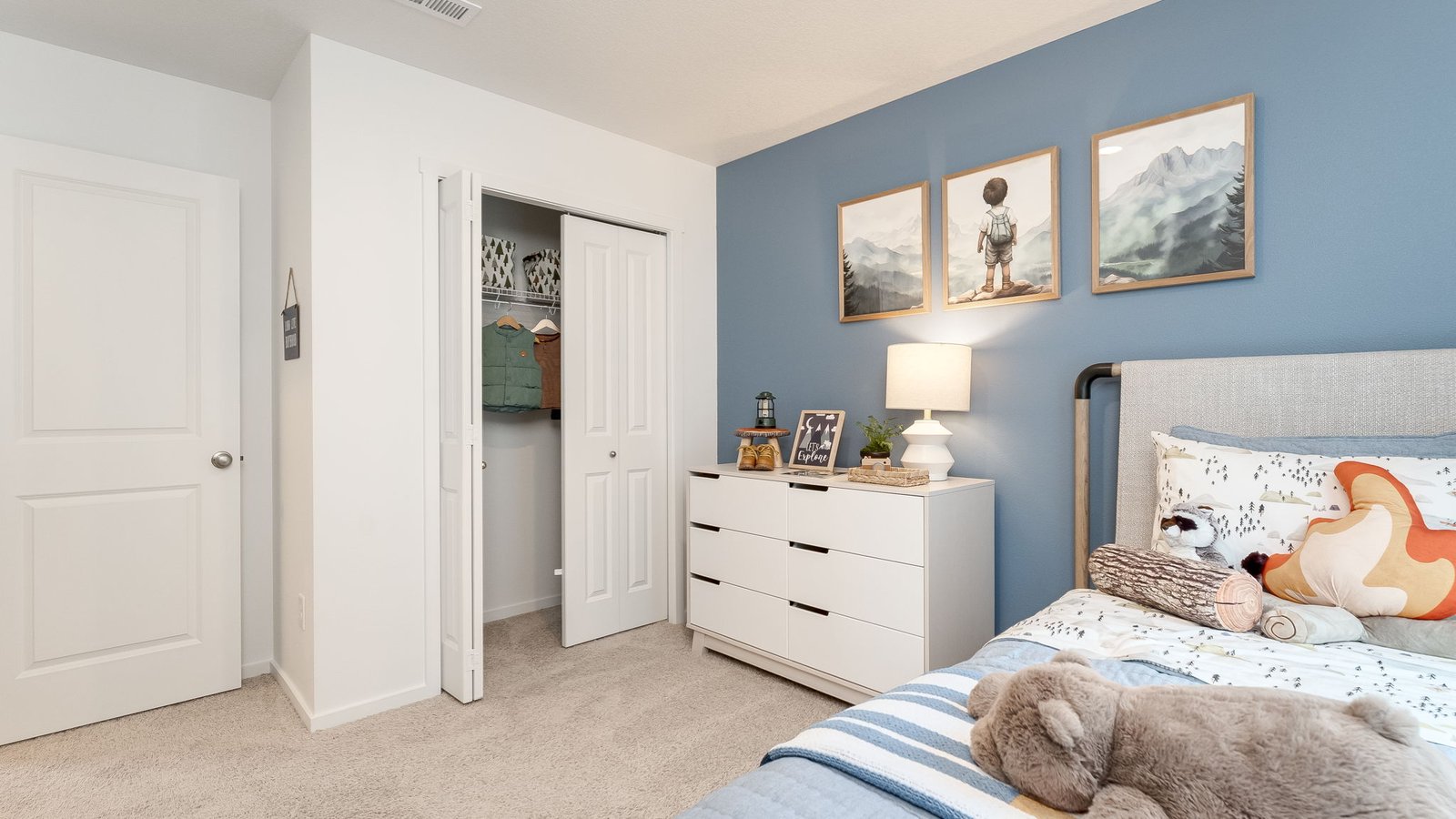 Bedroom with wall-to-wall carpet and a closet
