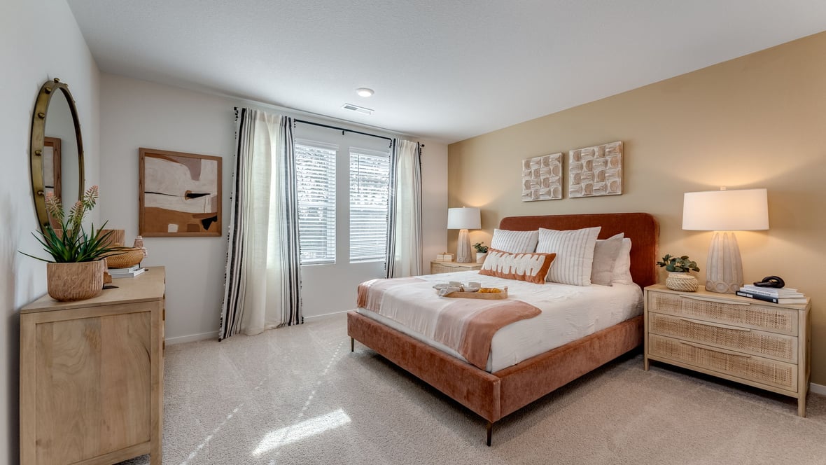Primary bedroom with wall-to-wall carpet, a walk-in closet and an attached bathroom