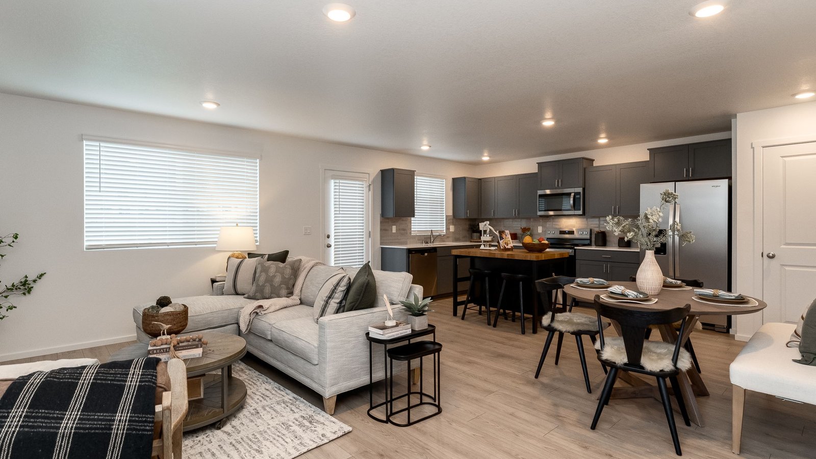 Great room with laminate flooring and an electric fireplace