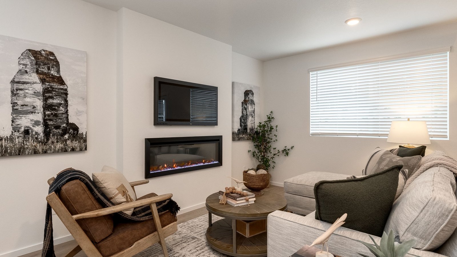 Great room with laminate flooring and an electric fireplace