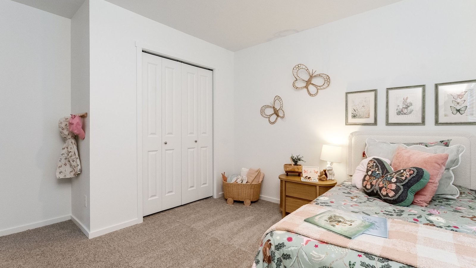 Bedroom with wall-to-wall carpet and a closet
