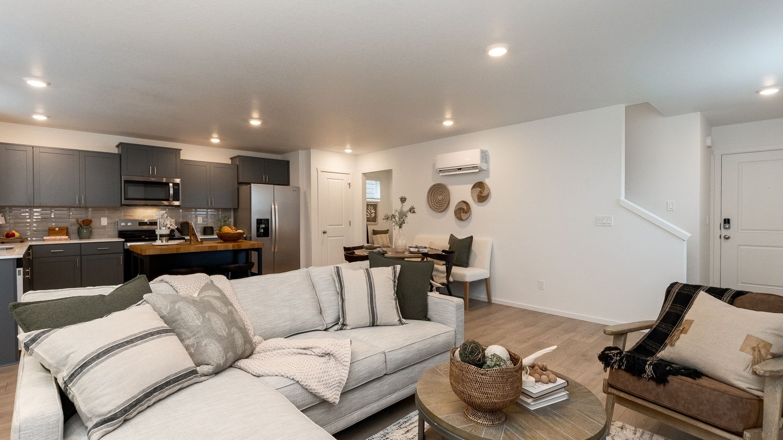 Great room with laminate flooring and an electric fireplace