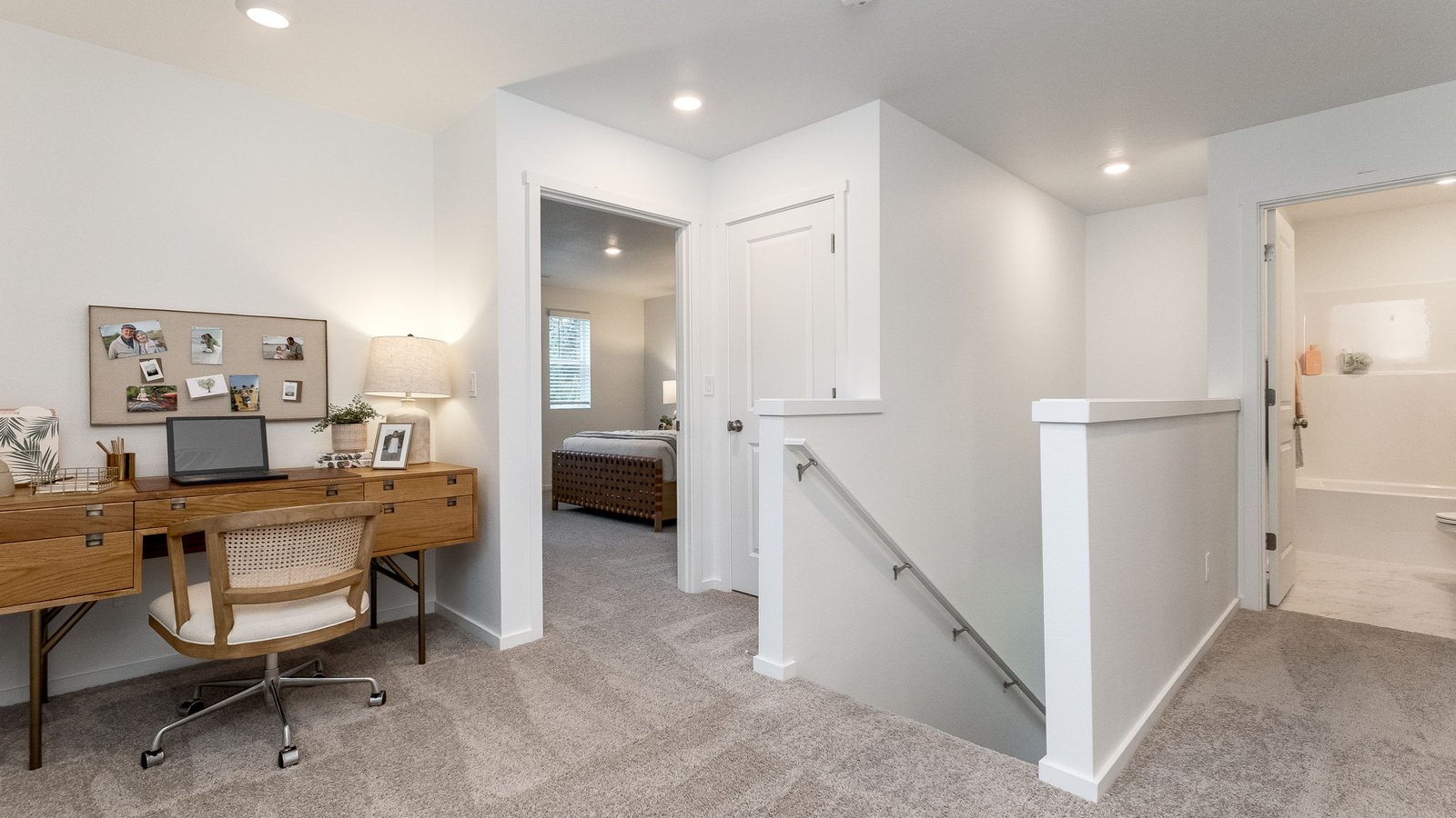 Hallway with wall-to-wall carpet
