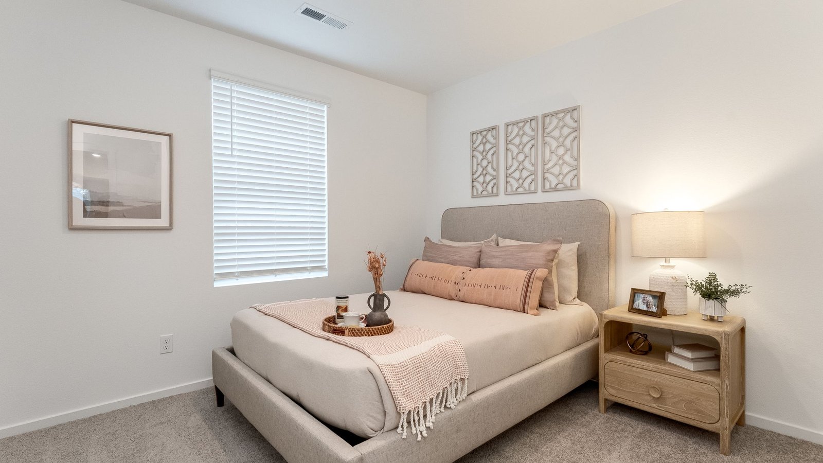 Bedroom with wall-to-wall carpet and a closet
