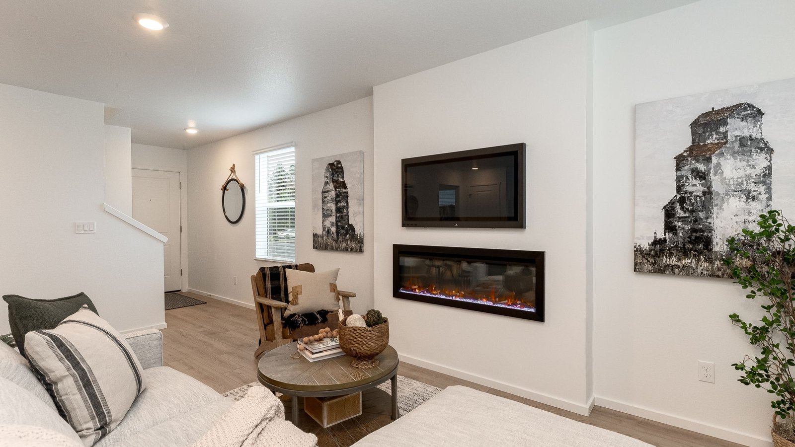 Great room with laminate flooring and an electric fireplace