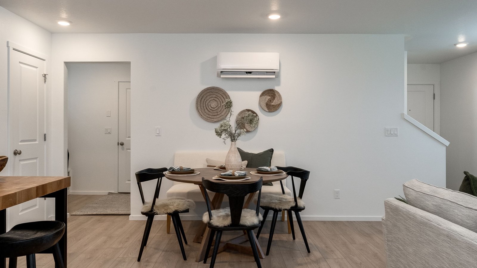 Great room with laminate flooring and an electric fireplace