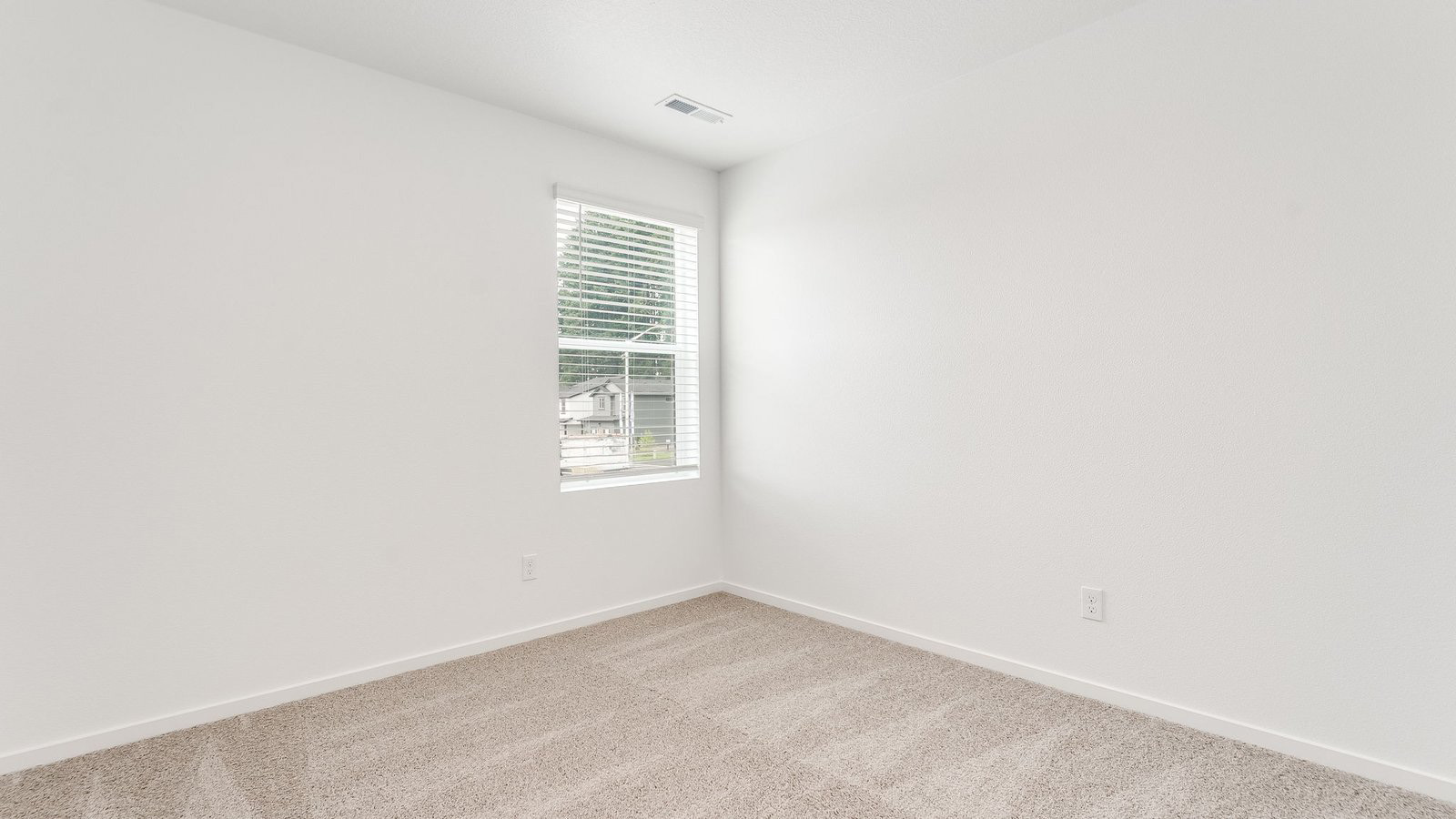 Bedroom with wall-to-wall carpet and a closet