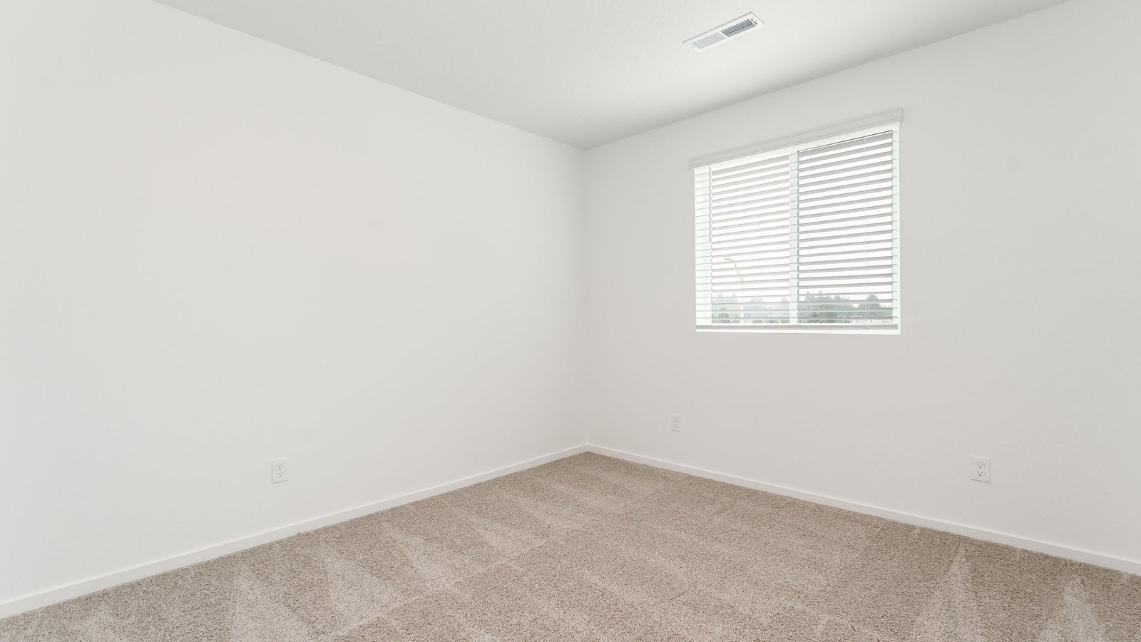 Bedroom with wall-to-wall carpet and a closet