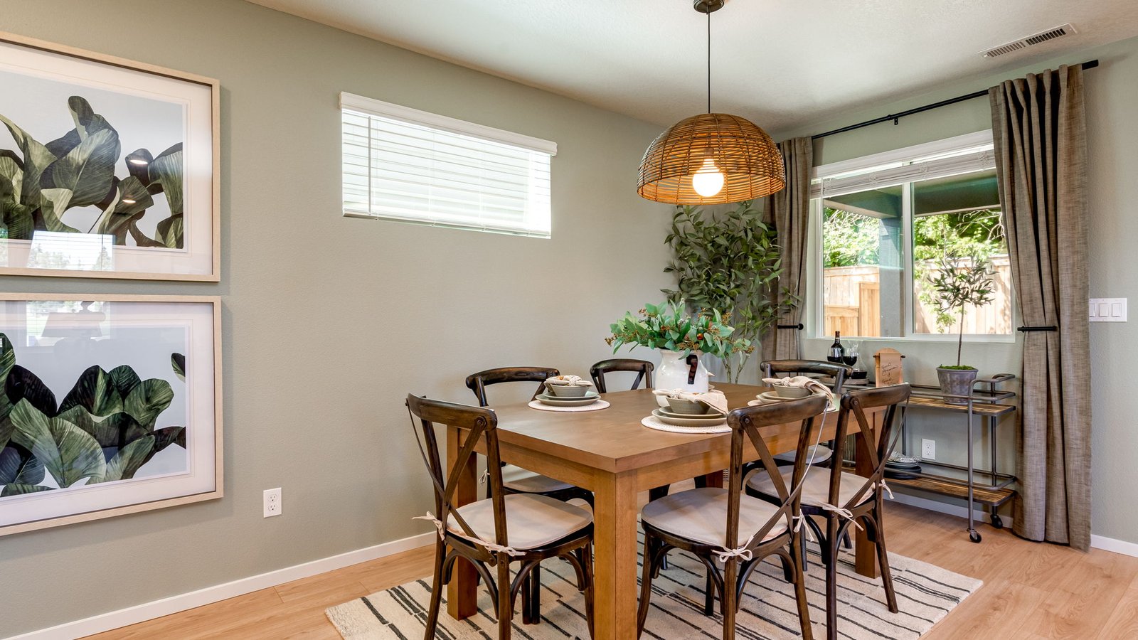 Dining area with a sliding glass door to a fenced backyard