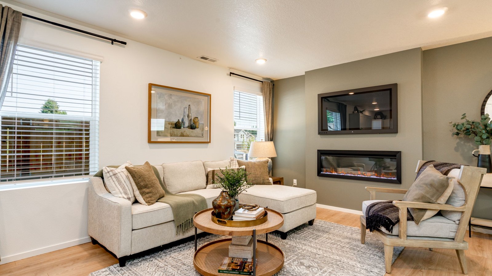 Great room with laminate flooring and an electric fireplace