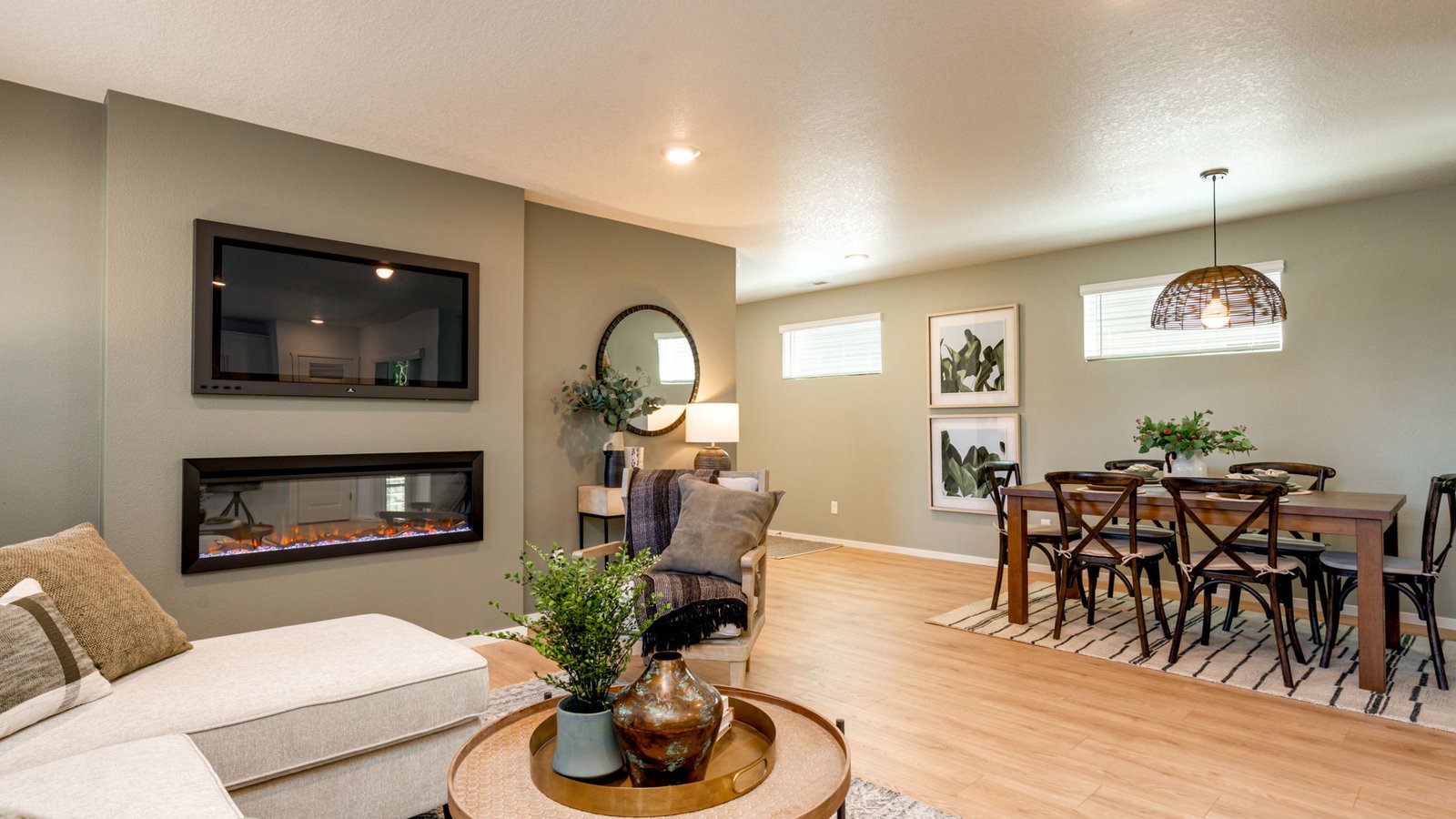 Great room with laminate flooring and an electric fireplace