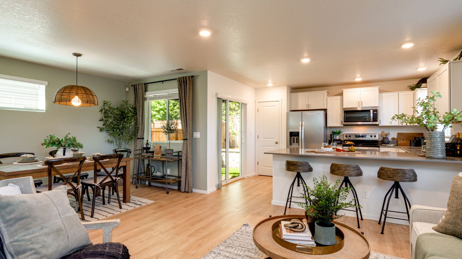 Great room with laminate flooring and an electric fireplace