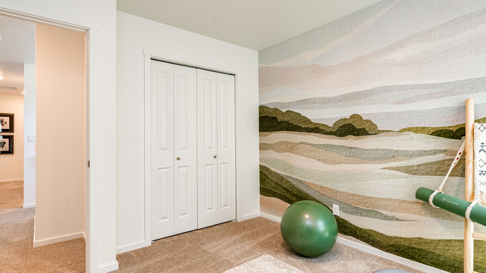 Bedroom with wall-to-wall carpet and a closet