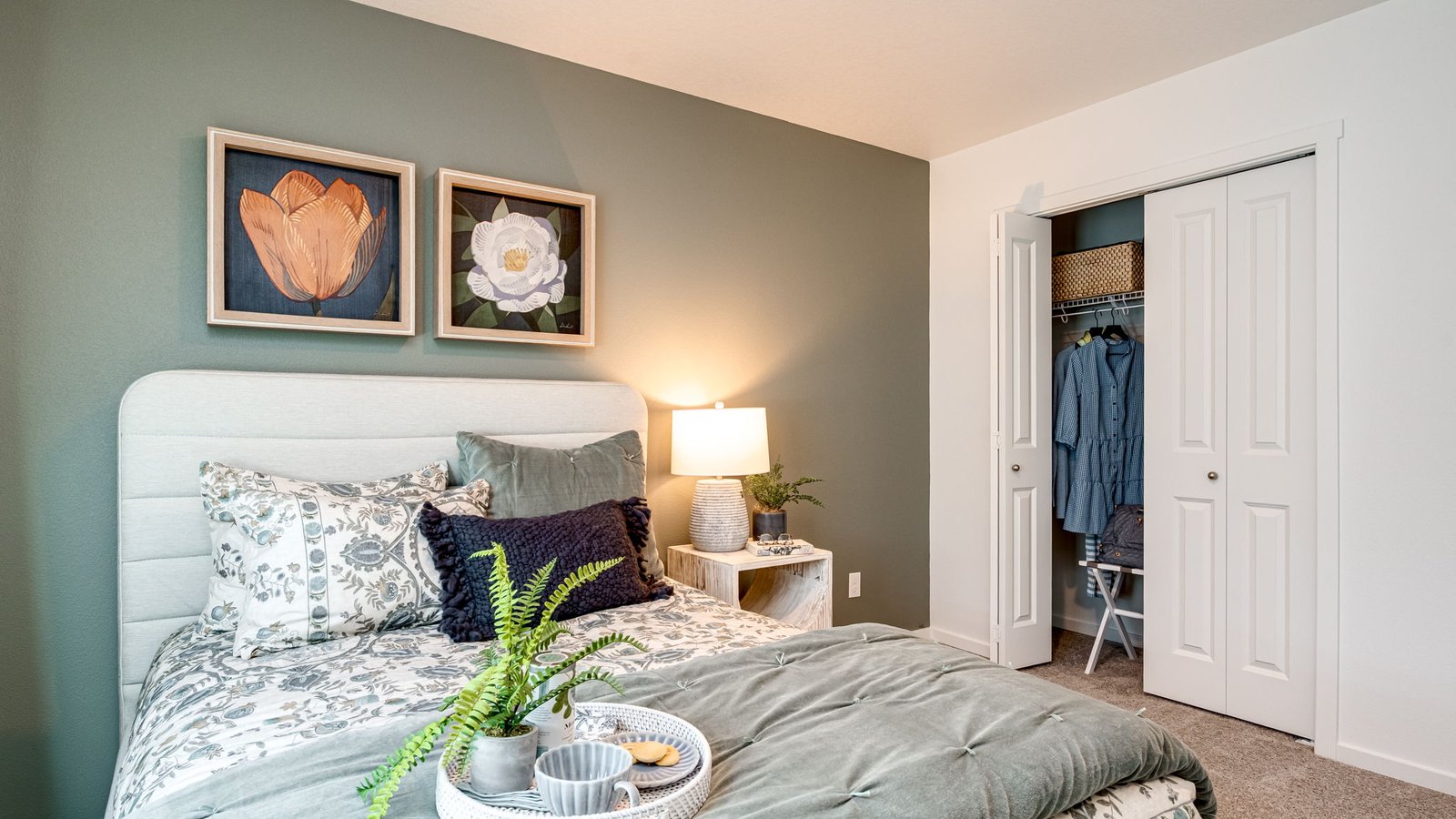 Bedroom with wall-to-wall carpet and a closet