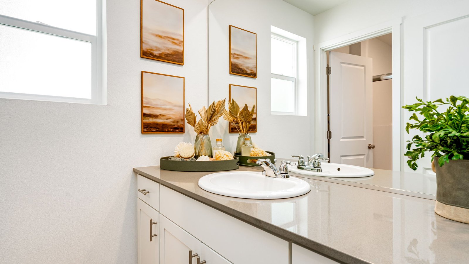 Primary bathroom with quartz counters and a walk-in shower