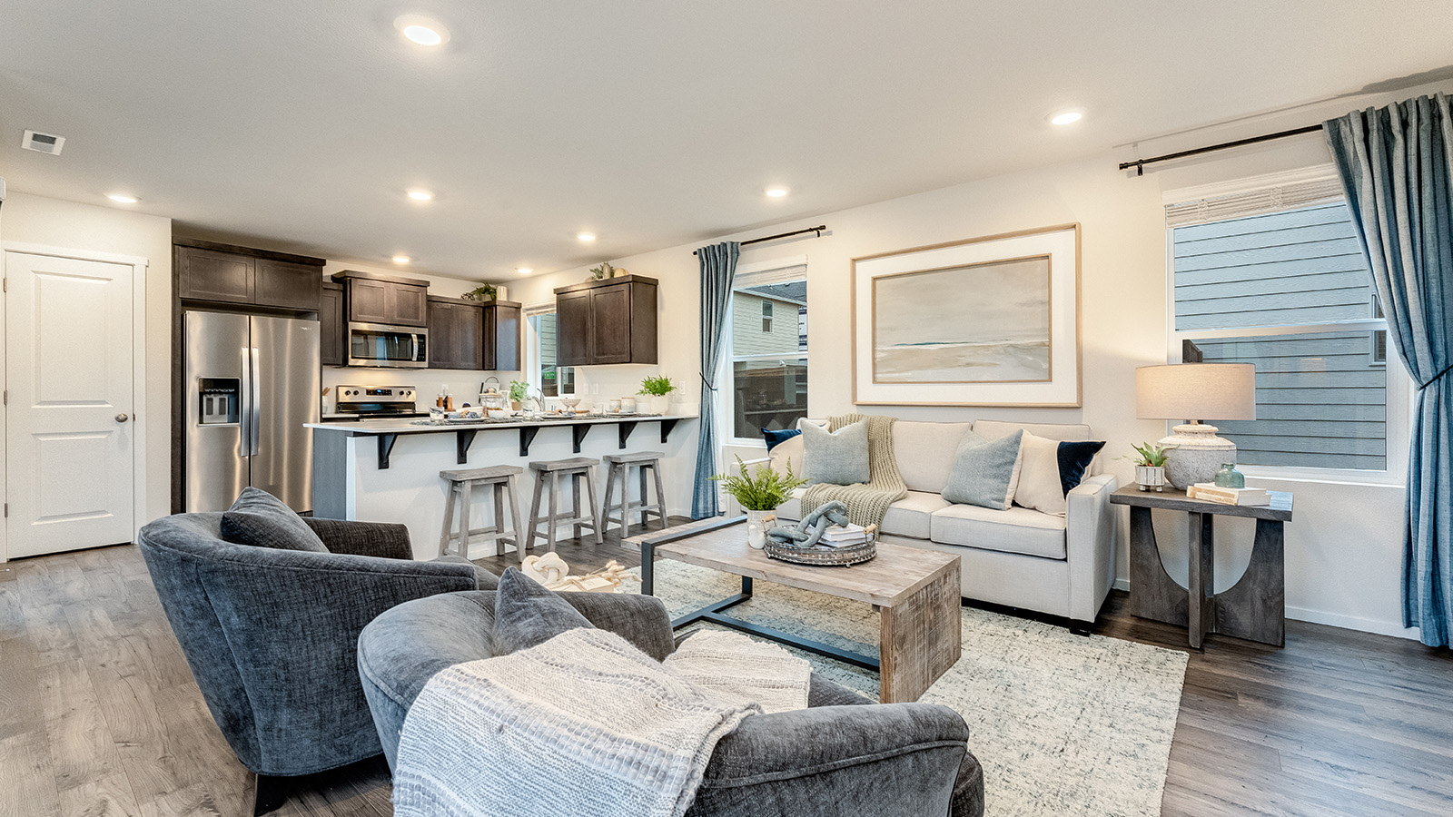 Great room with laminate flooring and an electric fireplace