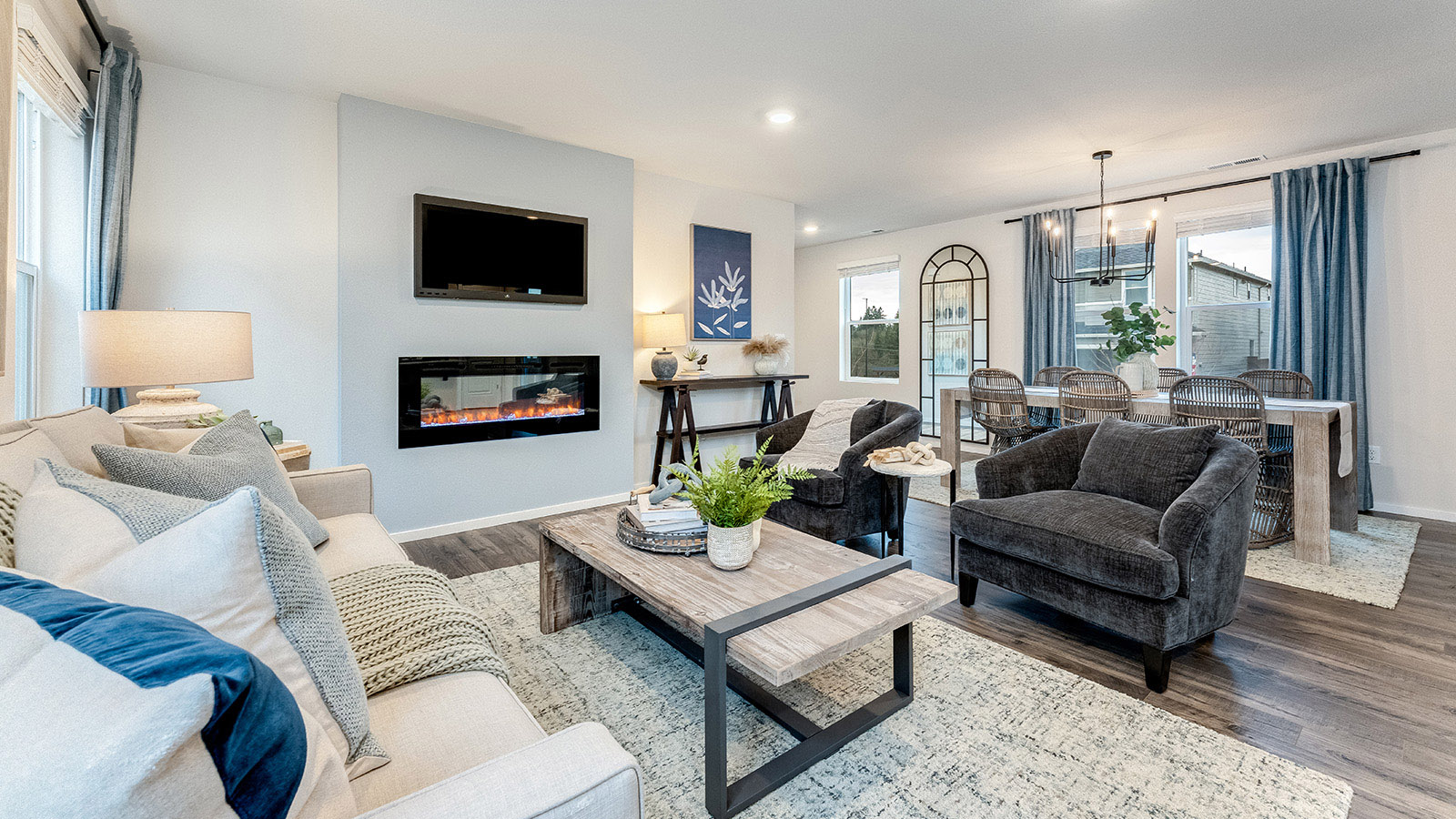 Great room with laminate flooring and an electric fireplace