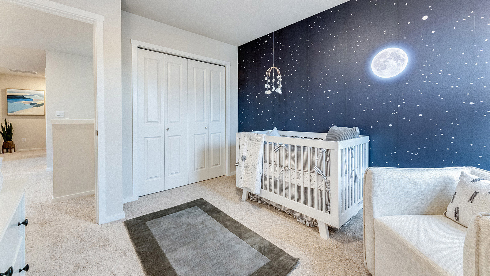 Bedroom with wall-to-wall carpet and a closet