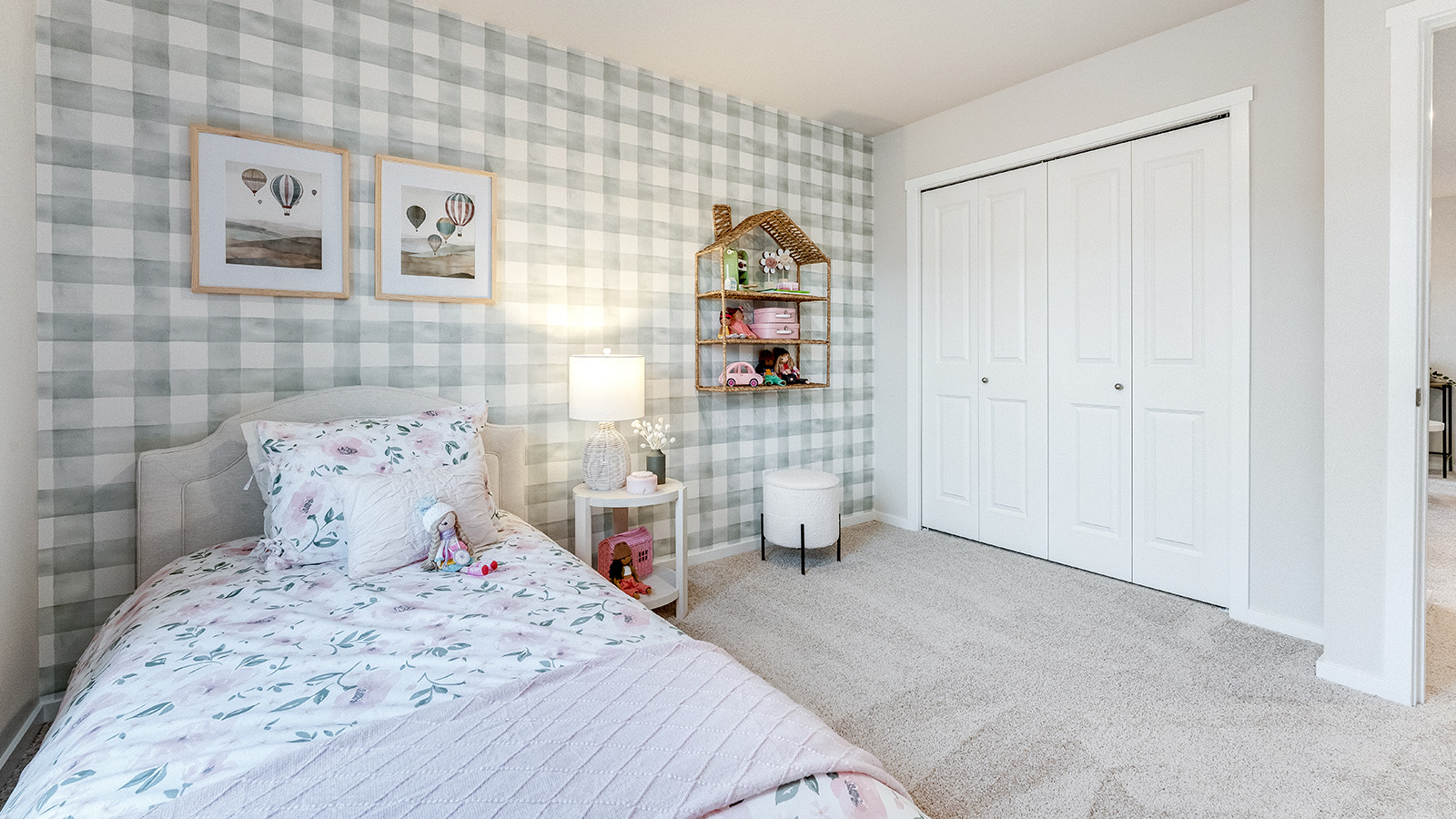 Bedroom with wall-to-wall carpet and a closet