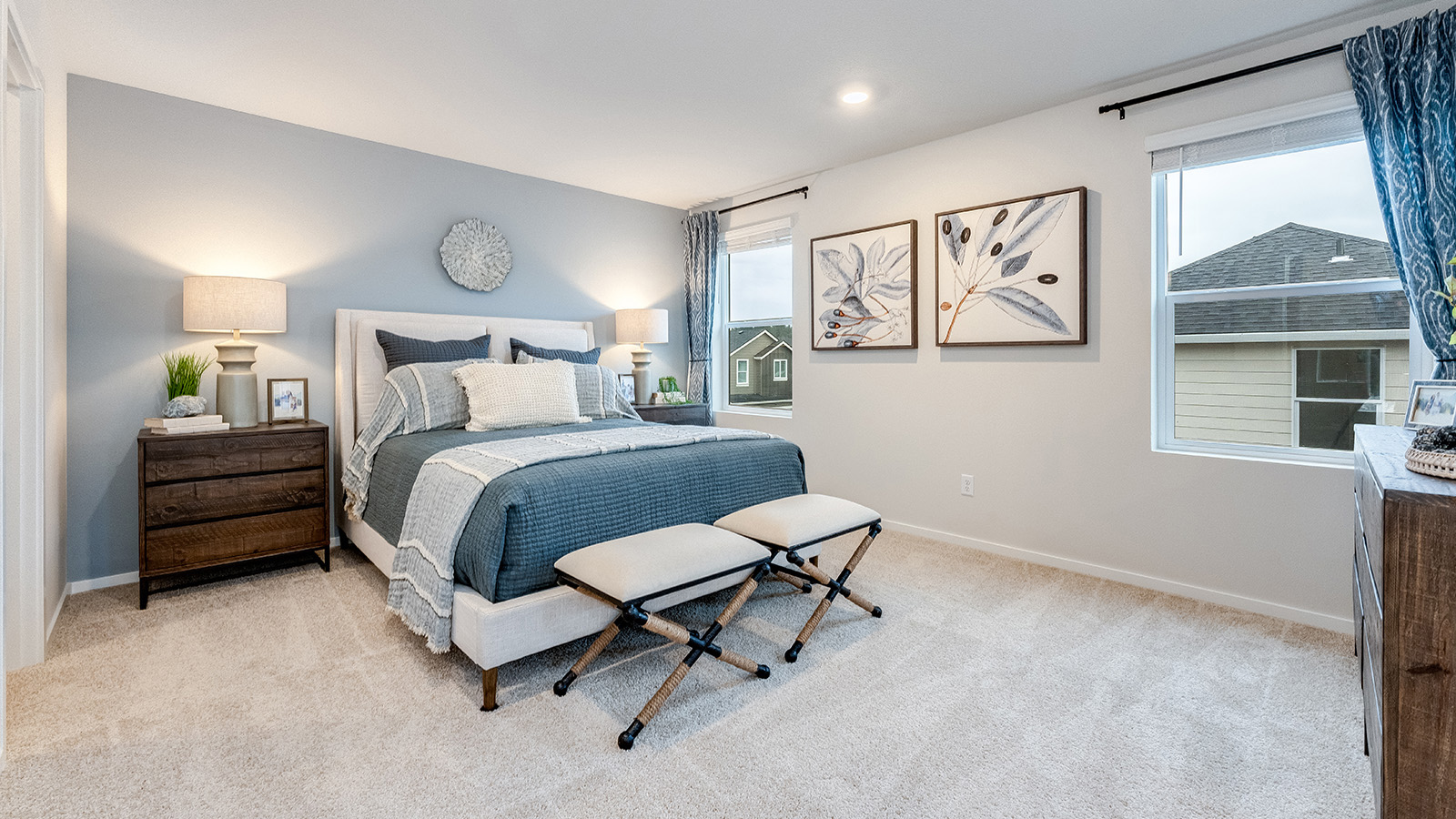 Primary bedroom with wall-to-wall carpet, a walk-in closet and an attached bathroom