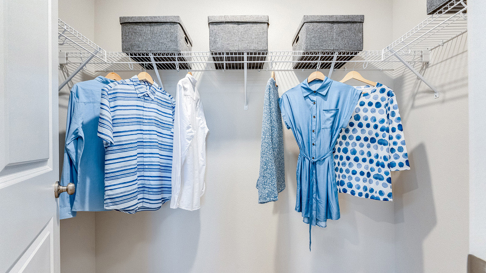 Primary bedroom walk-in closet with wire shelves