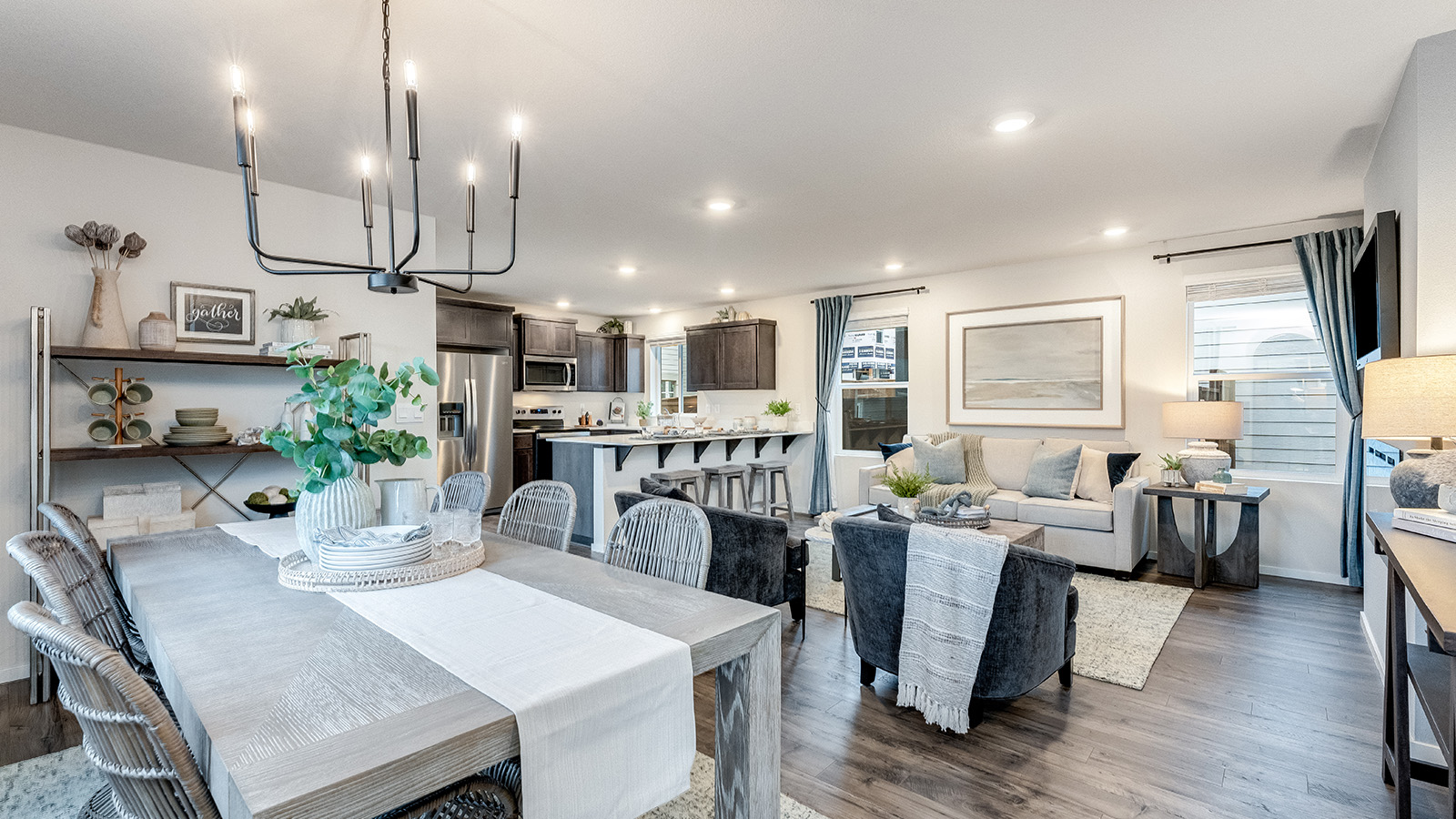 Great room with laminate flooring and an electric fireplace