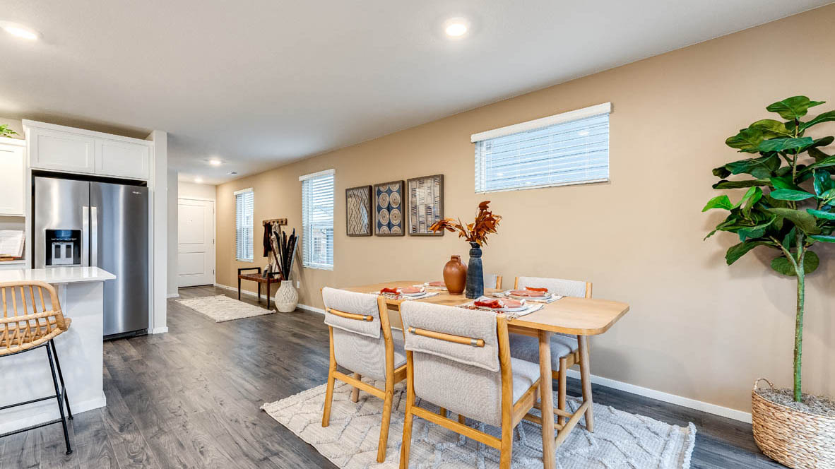 Dining area with a sliding glass door to a fenced backyard