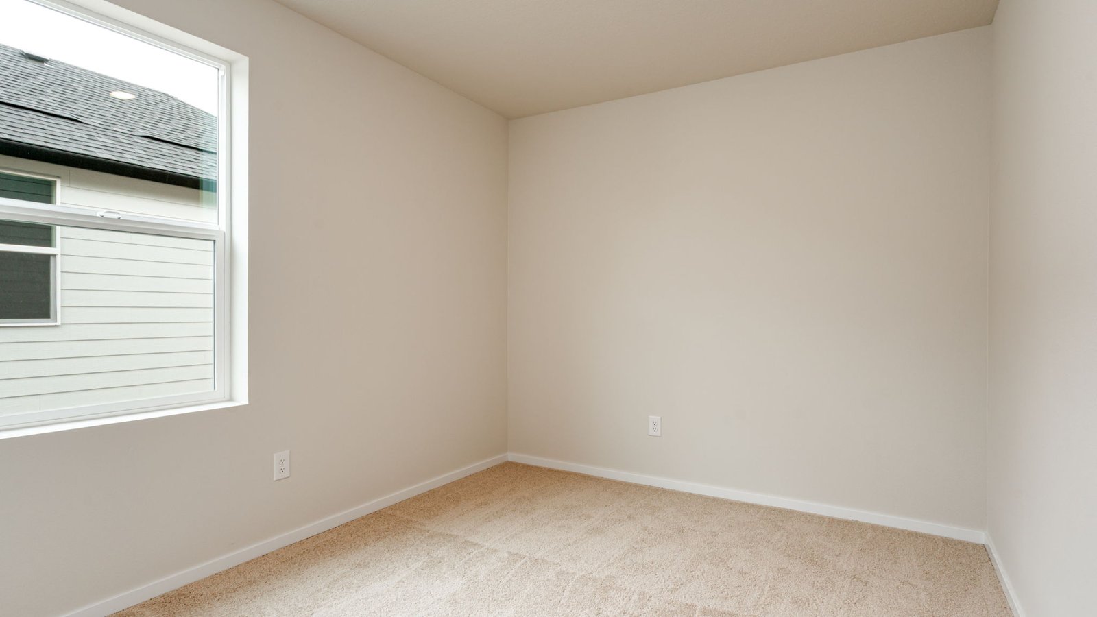 Bedroom with wall-to-wall carpet and a closet
