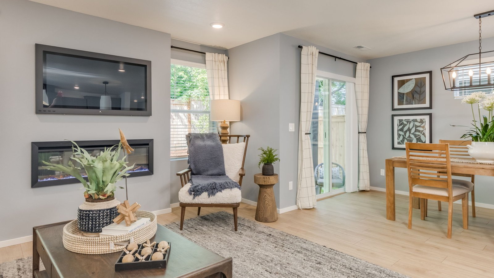 Great room with laminate flooring and an electric fireplace