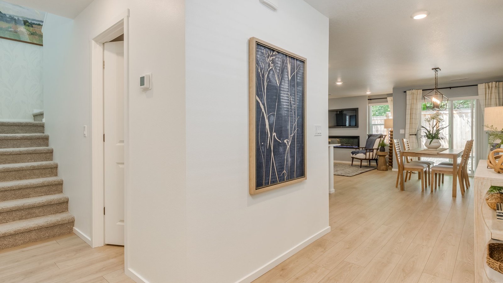 Entryway with a coat closet and laminate flooring