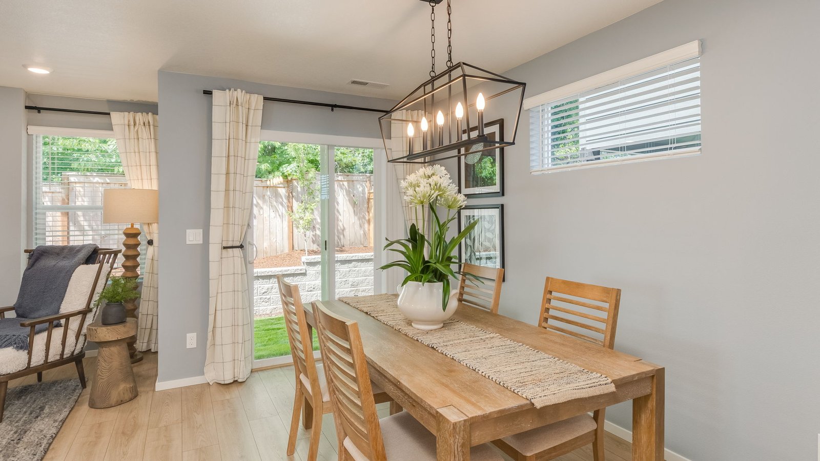Dining area with a sliding glass door to a fenced backyard
