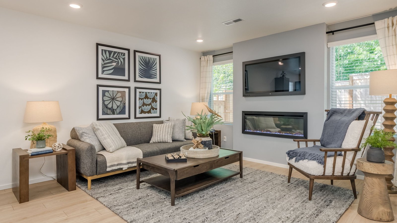Great room with laminate flooring and an electric fireplace
