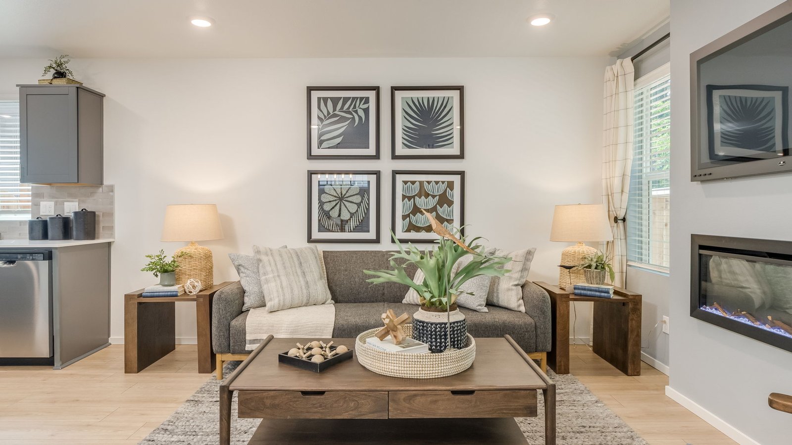 Great room with laminate flooring and an electric fireplace