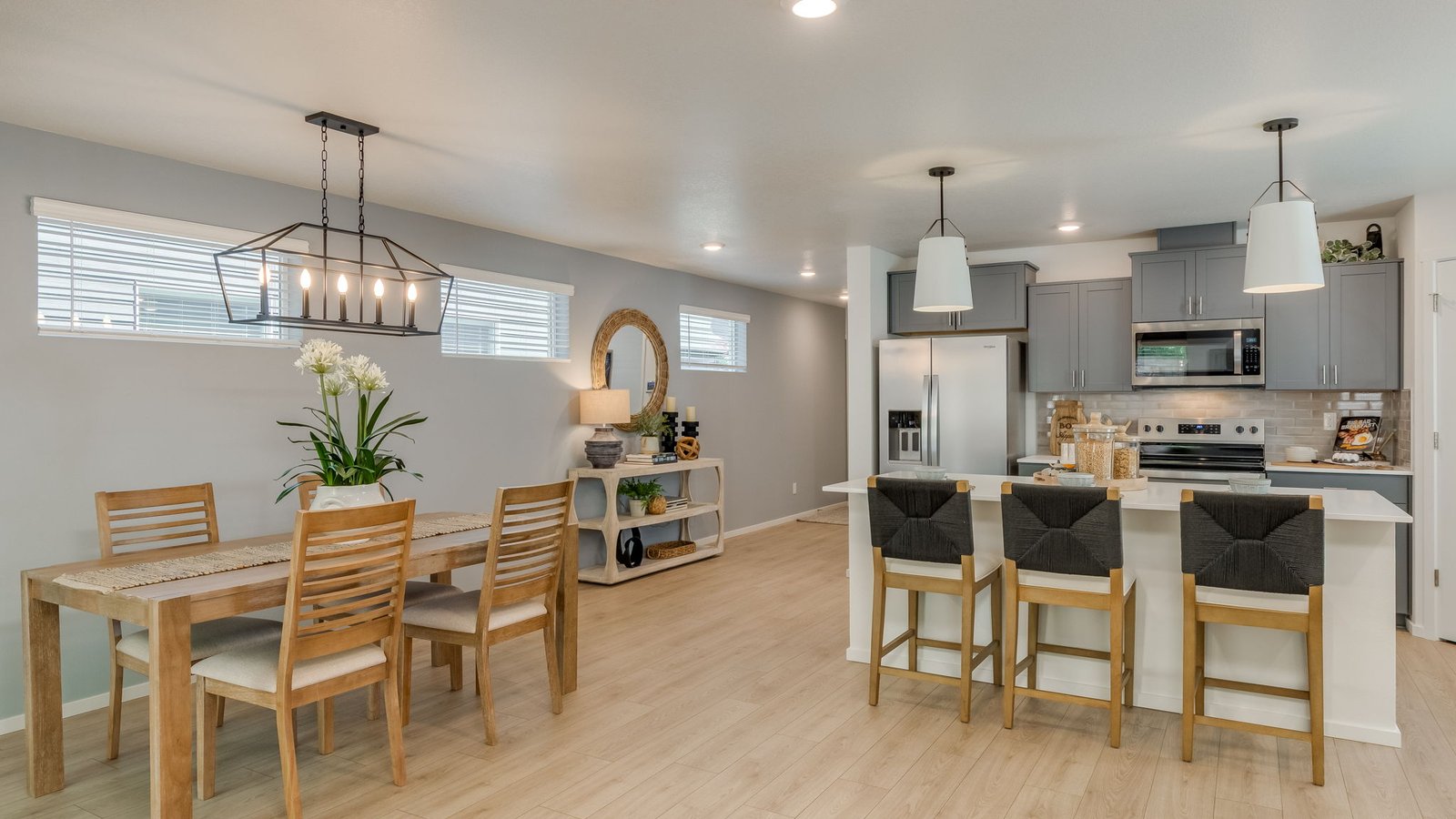 Great room with laminate flooring and an electric fireplace