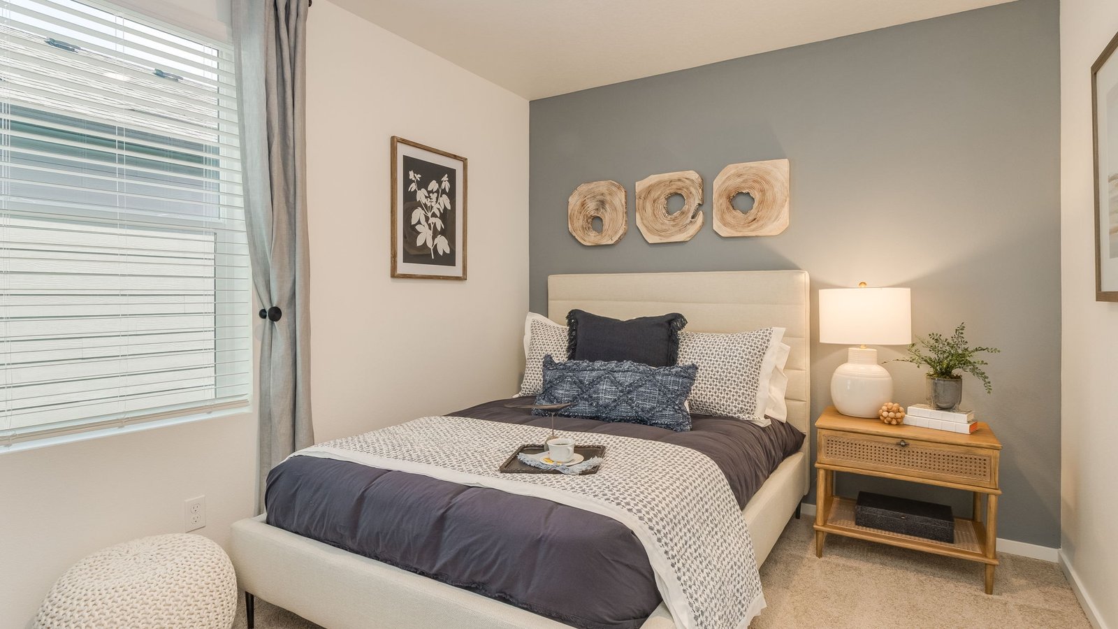 Bedroom with wall-to-wall carpet and a closet