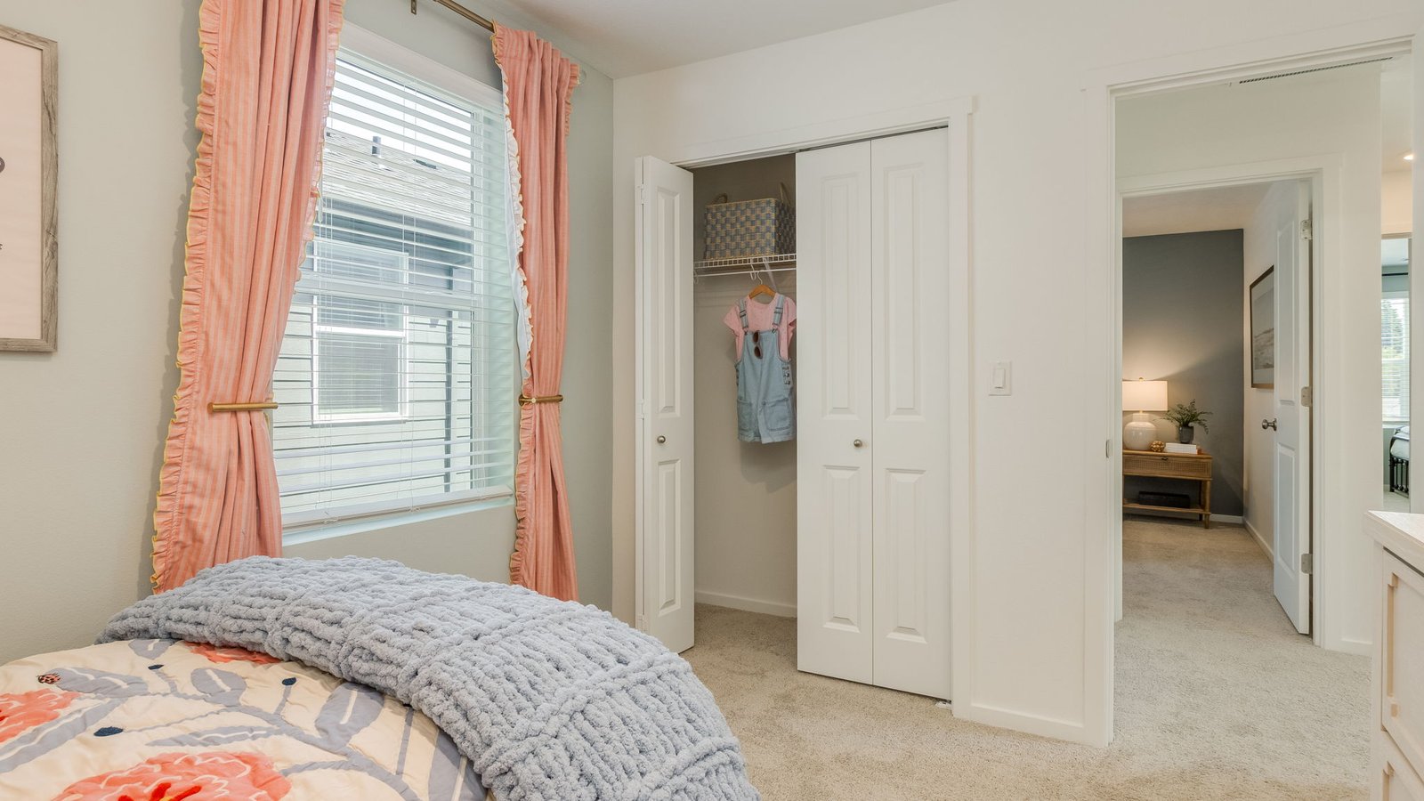 Bedroom with wall-to-wall carpet and a closet