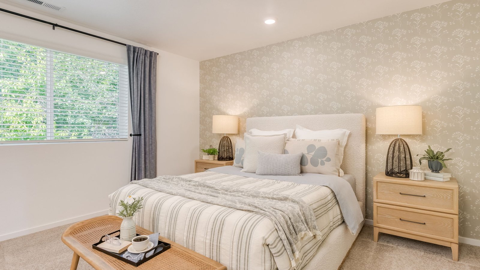 Primary bedroom with wall-to-wall carpet, a walk-in closet and an attached bathroom