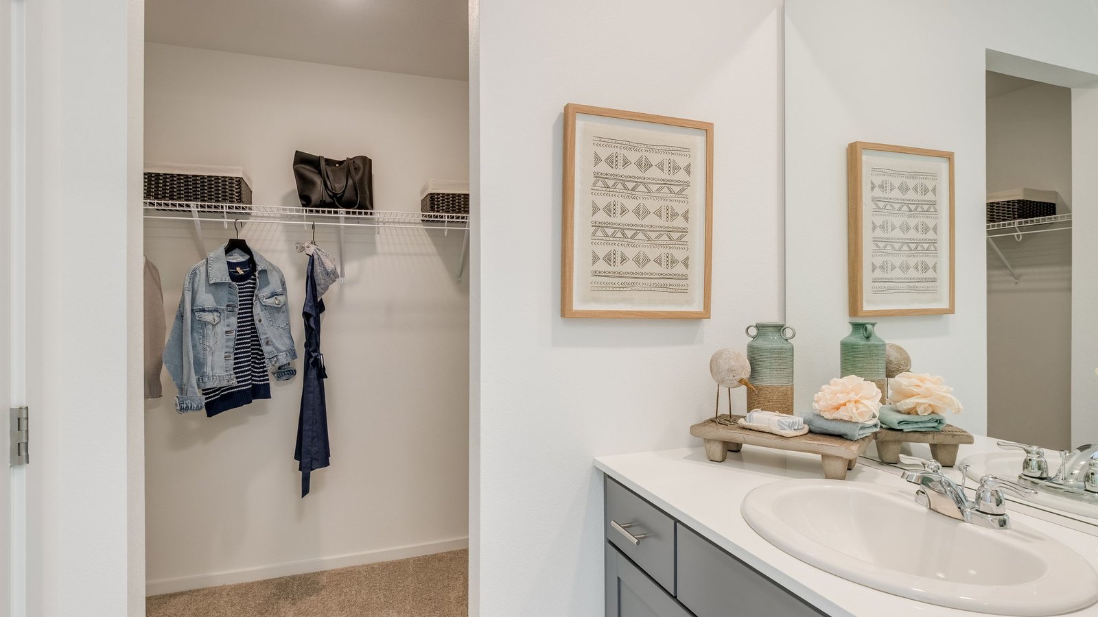 Primary bathroom with quartz counters and a walk-in shower