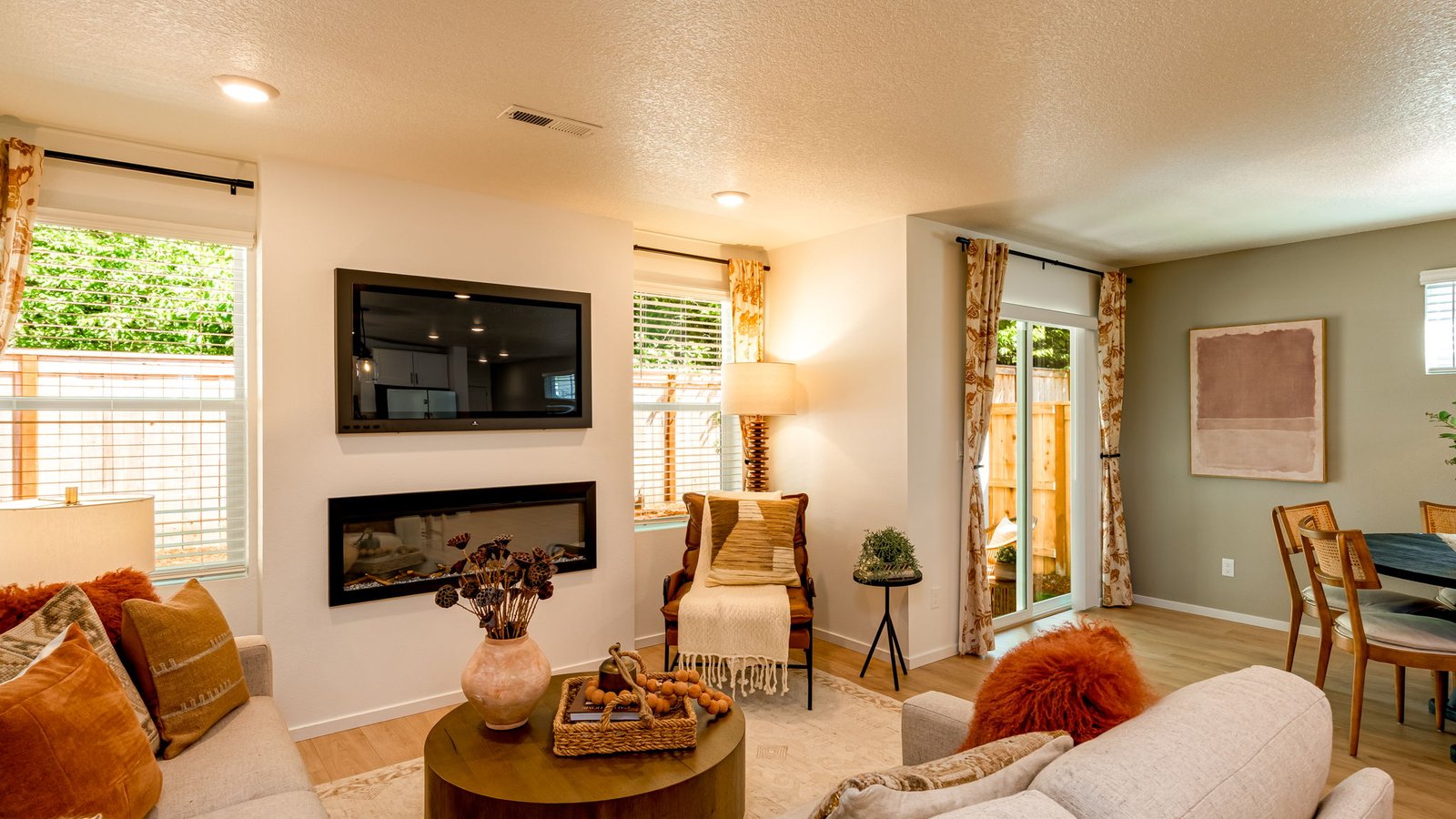 Great room with laminate flooring and an electric fireplace